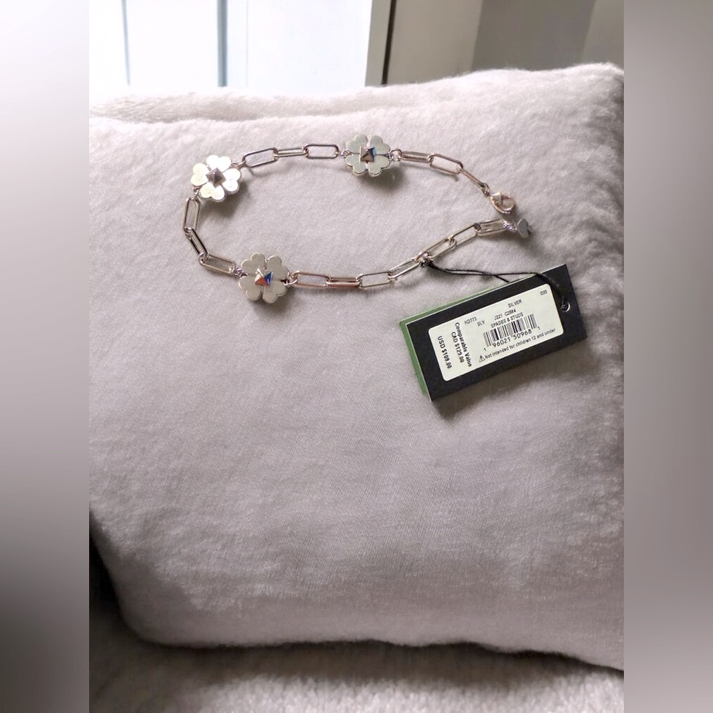 Kate Spade Silver Flower Chain Paperclip Bracelet with Hearts.